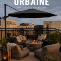 Terrasse urbaine élégamment décorée avec des plantes et des meubles confortables.
