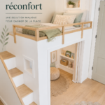 Un lit en hauteur bien aménagé dans un loft moderne, créant un espace cosy et pratique.